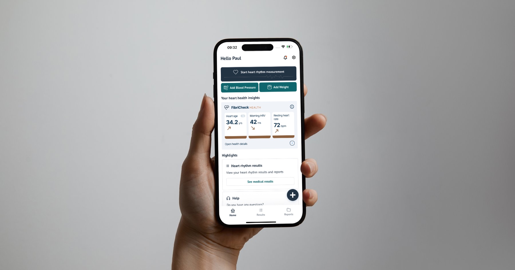 A hand holding a phone with the FibriCheck home screen open, showing a button to start a heart rhythm measurement and the heart health insights: a heart age of 34.2 years, a morning HRV of 42 ms and a resting heart rate of 72 bpm.