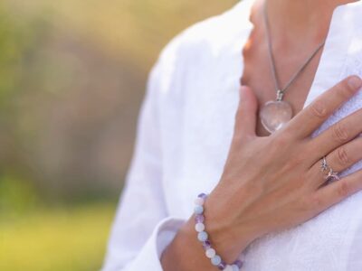 Woman Holding Hand Over Heart