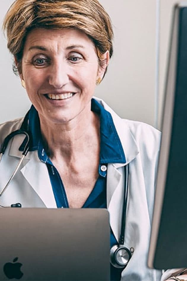 physician behind computer