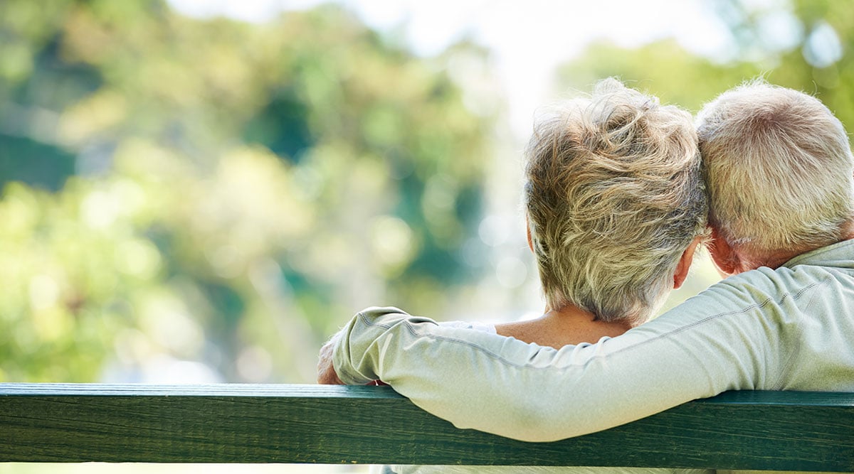 older couple on park bench