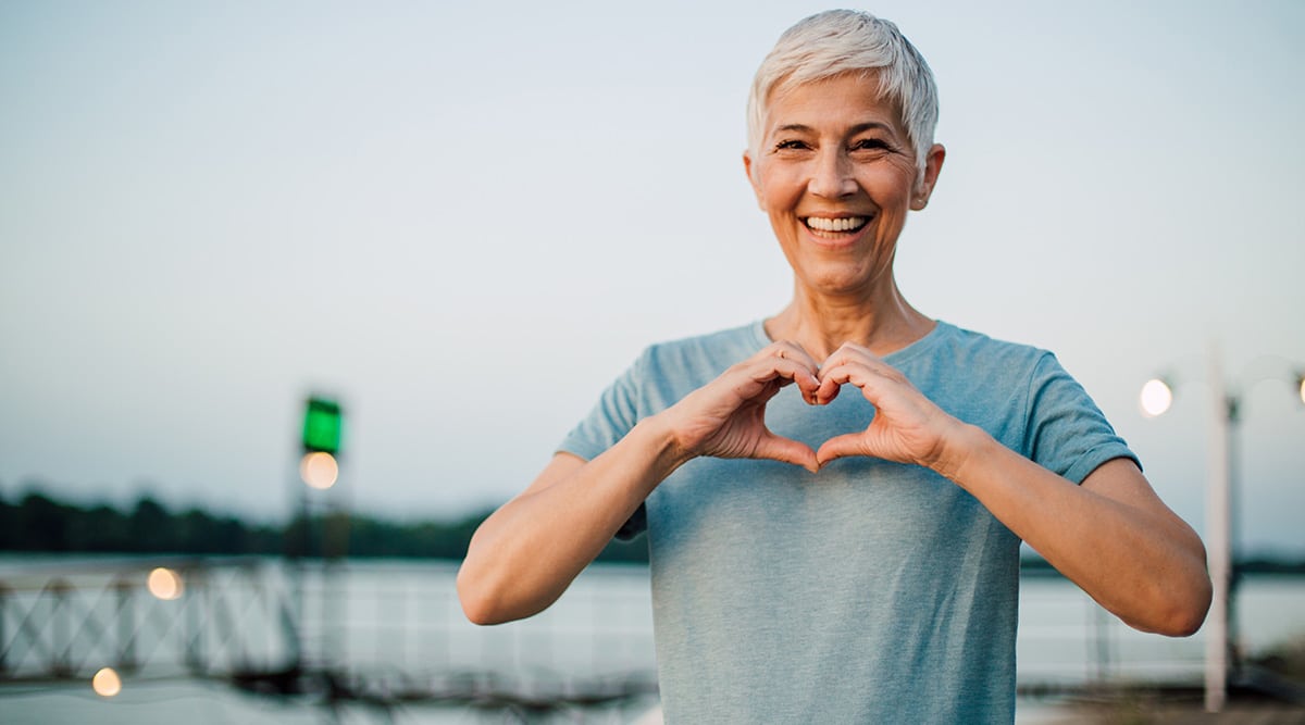 woman making heart shape with her hands